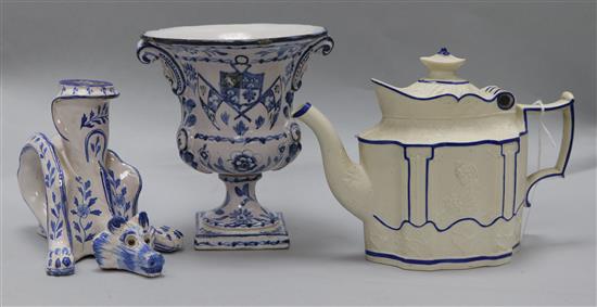 A Continental blue and white figural animal candlestick, an urn-shaped vase and a Castleford relief-decorated teapot (faults)